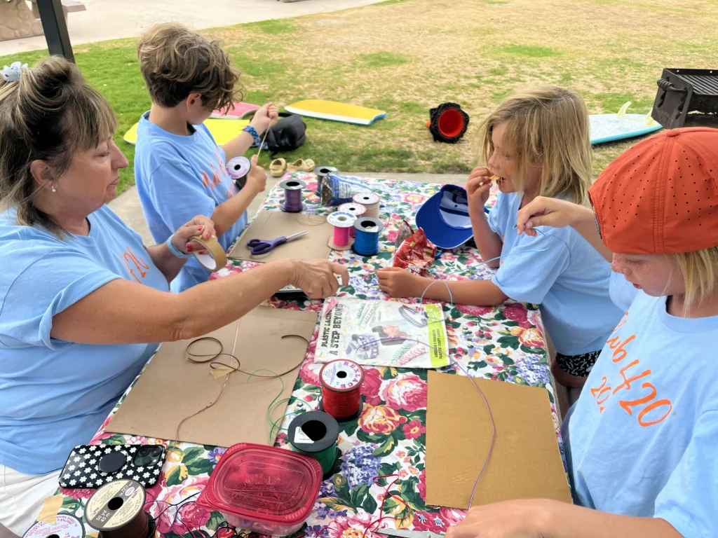 LPC-Club H2O 2025-kids doing art around a table